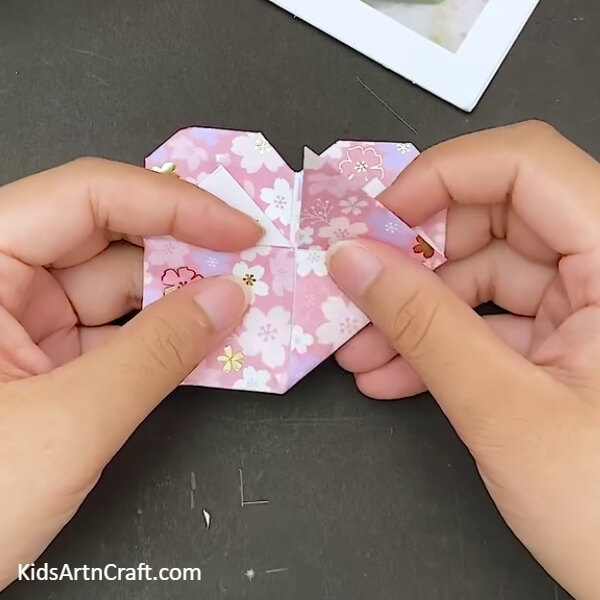 Fold The Bottom Section Back- Follow this comprehensive step-by-step tutorial to make an Origami Heart Envelope. 