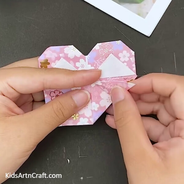 Align The Two Triangles- Learn how to make an Origami Heart Envelope with this step-by-step guide. 