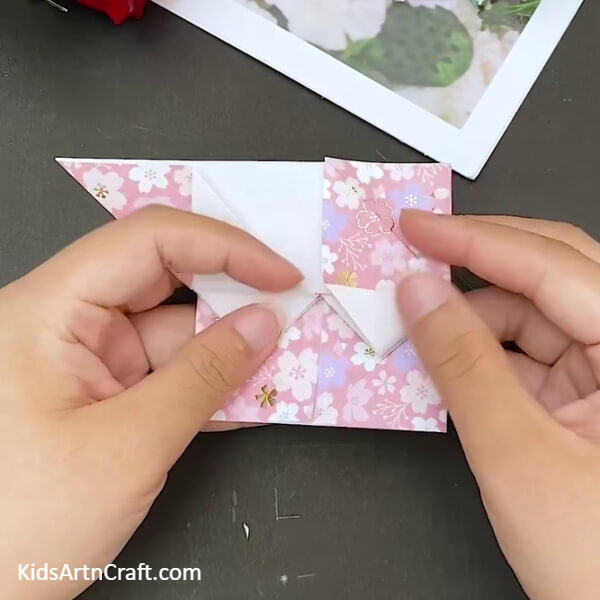 Make Folds On the Top Section As Well- Step-by-step instructions to build a heart-shaped envelope with origami