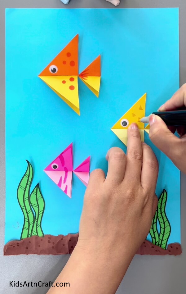 Making More Fish And Detailing Them-A tutorial for creating origami fish - simple enough for kids