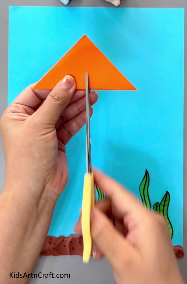 Cutting The Triangle-A straightforward guide to creating origami fish for children