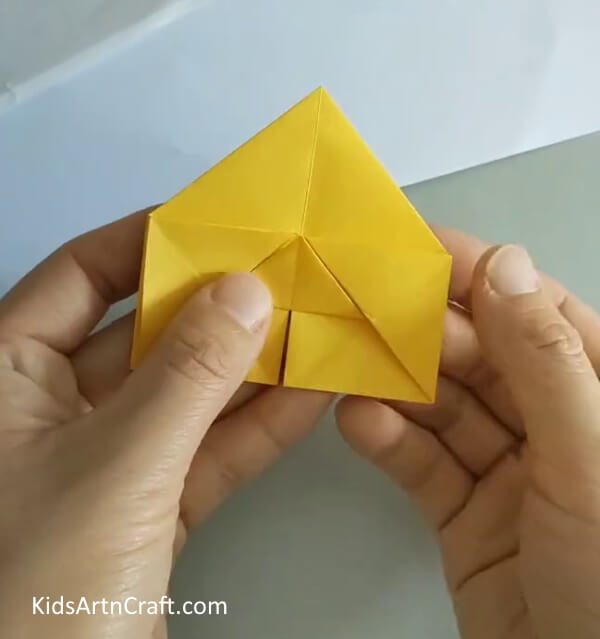 Bring the sides of the bigger triangle towards the back- A Tutorial to Make an Origami Rose for the Starting Level