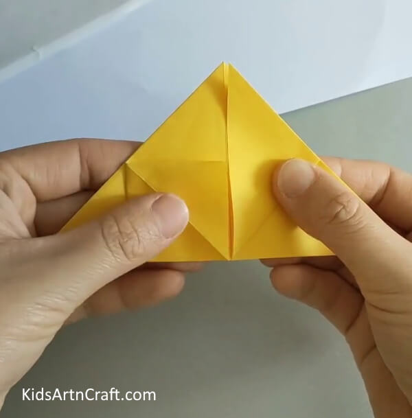 create small pockets by giving a small fold- Crafting a Rose from Origami for Beginners