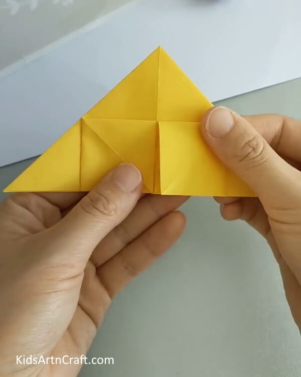 Bring the other portion outwards- An Easy Tutorial for Forming a Rose with Origami