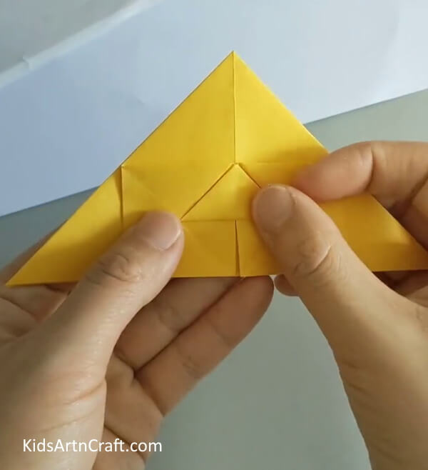 Fold the middle portion upwards- Create a Rose from Origami with This Step-by-Step Guide