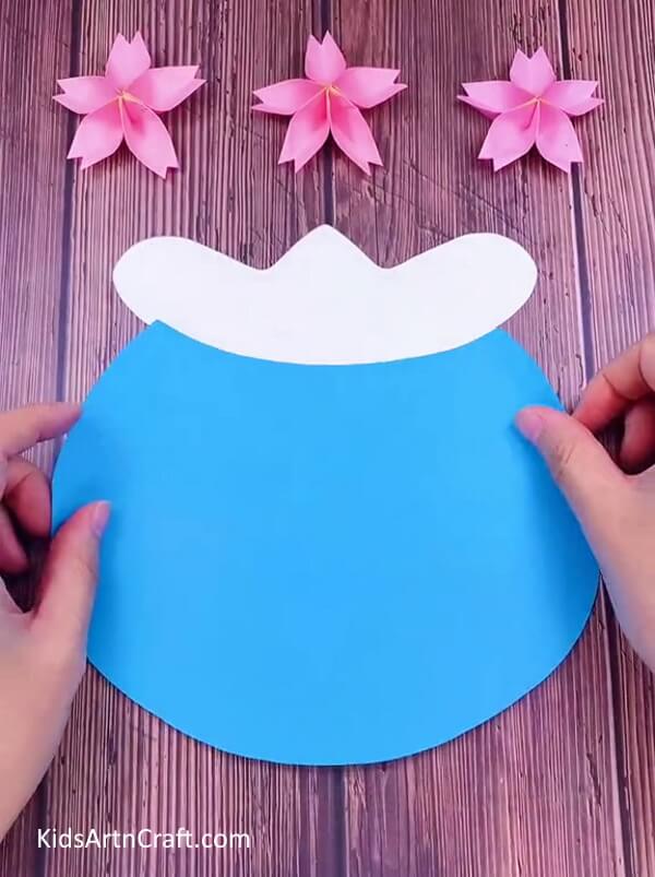 Blue cutout sheet covering middle half of the bowl. Make an Aquarium for childrens