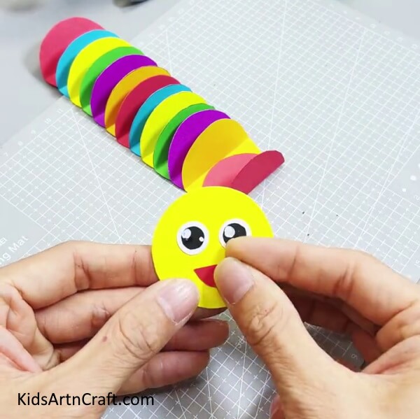 Adding Mouth To The Yellow Circle - Make a Spherical Paper Caterpillar Creation For Kids 