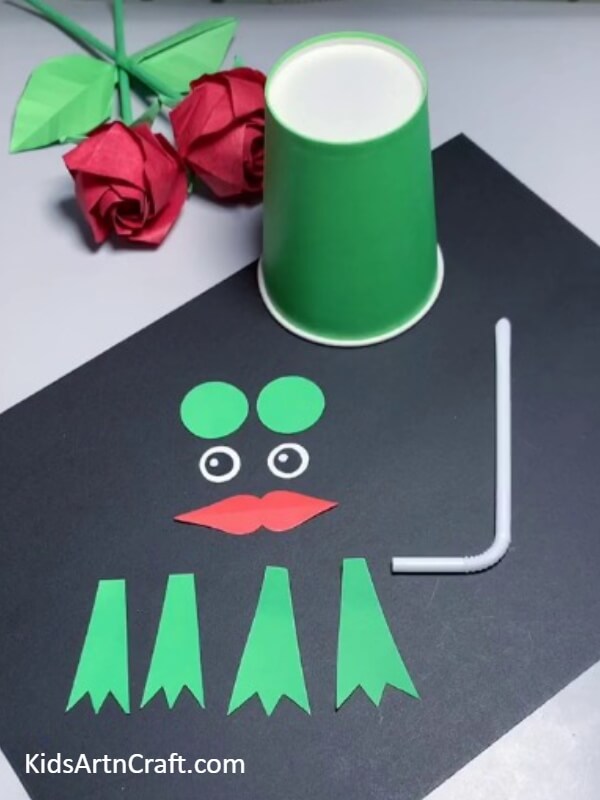 Gathering Materials And Cutouts-This tutorial shows children how to make a frog puppet out of a paper cup