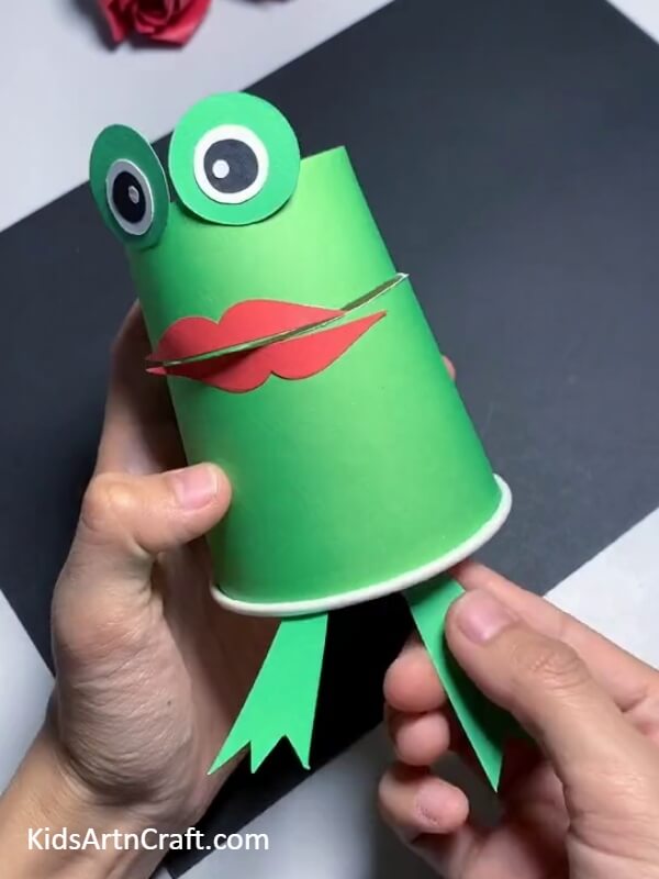 Pasting The Front Legs- Learn How to Create a Frog Puppet Out of a Paper Cup for Kids