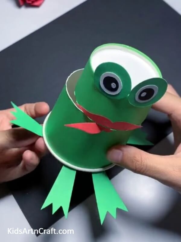 Pasting The Hind Legs-Crafting a Frog Puppet with a Paper Cup - A Tutorial for Kids