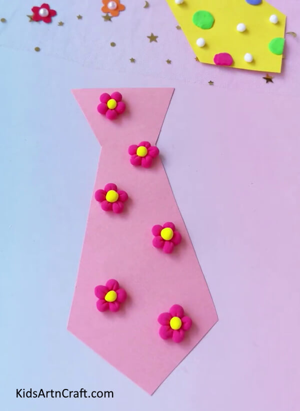 Pasting The Clay Flowers On The Pink Neck-Tie - A Comprehensive Guide to Making a Paper Necktie with Step-wise Instructions