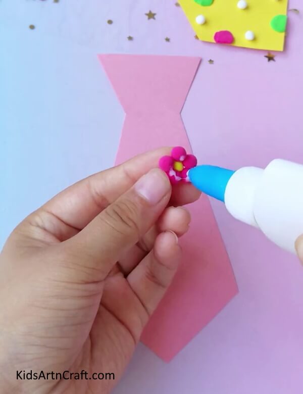 Applying Glue on The Pink Flower - An Illustrated Tutorial on How to Build a Paper Necktie
