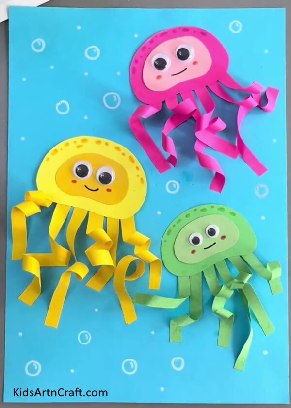 Draw Tiny Bubbles On The Blue Paper- Developing a Paper Octopus Project for Kids 