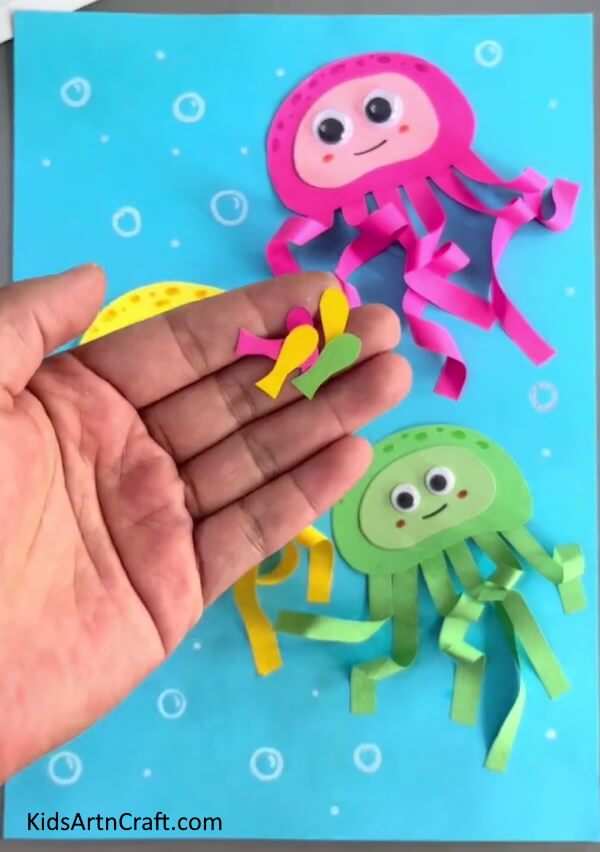 Paste Tiny Fishes On Your Ocean With The Help Of Glue- Making a Paper Octopus for Children 