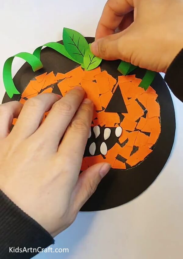 Creating Two Leaves and Stick them on Double Sided Tape - Instructions on Creating a Paper Pumpkin Art Piece Step-by-Step