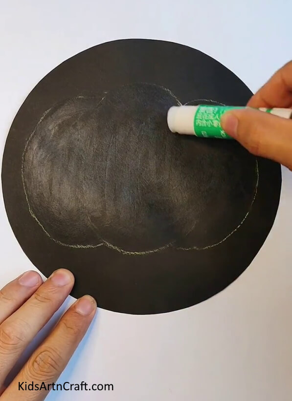 Drawing a Pumpkin Outline on a Black Cardboard - Creating a paper pumpkin using this tutorial