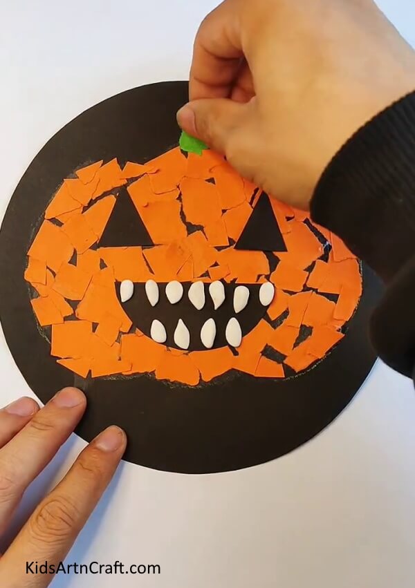 Sticking Tape on the Top Middle of the Pumpkin - Follow this tutorial to make a paper pumpkin