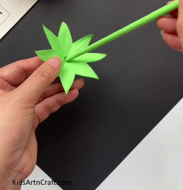 Adding Sepals Follow these steps to make a paper rose flower with kids. 