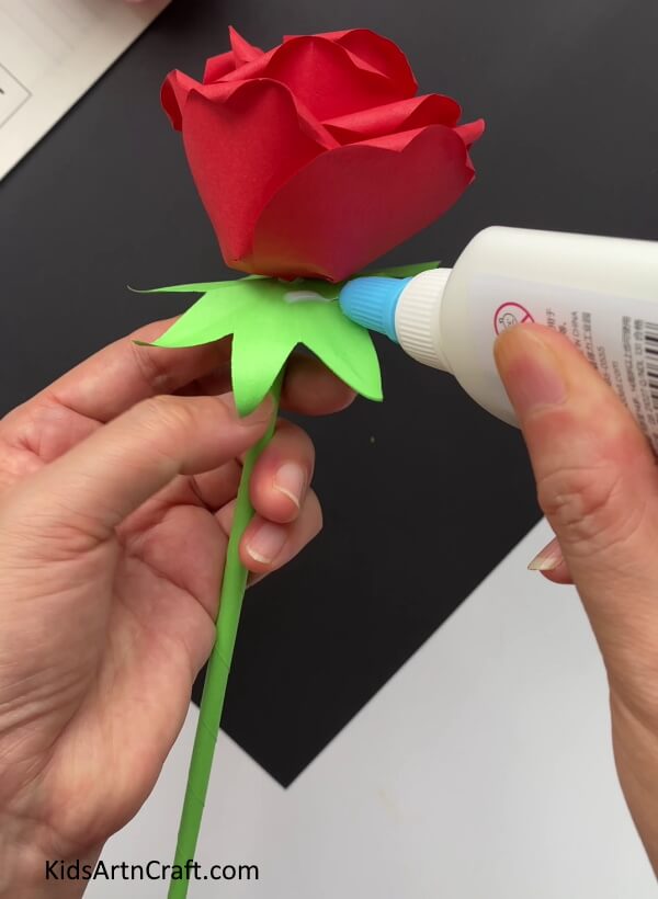 Pasting Sepals To The Bottom Of The Red Rose This guide will help you show kids how to make a paper rose flower.