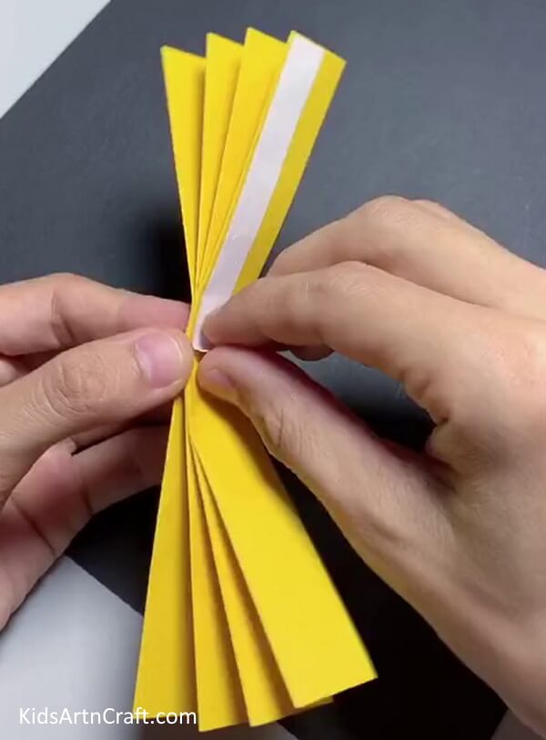 Sticking Thin Double-sided Tape in the Middle - Producing a Paper Sunflower Project for little ones