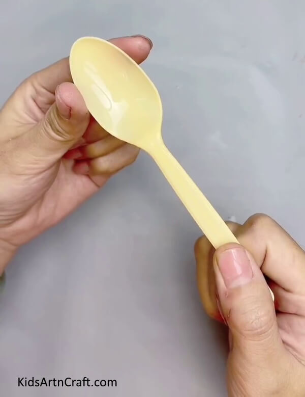 Cutting Out The Bowl Of Spoon- A Guide for Creating a Lampshade out of Plastic Spoons 
