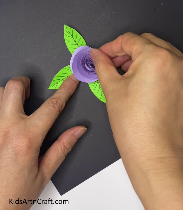 Attaching The Flower On The leaves How to Assemble an Amethyst Paper Flower With Leaves