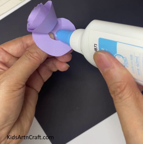 Pasting The Ends Of The Spiral Creating a Lilac Paper Flower With Leaves Step-by-Step