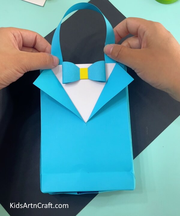 Making Bag Handle- Putting Together an Origami Shirt and Bow Paper Bag at Home 