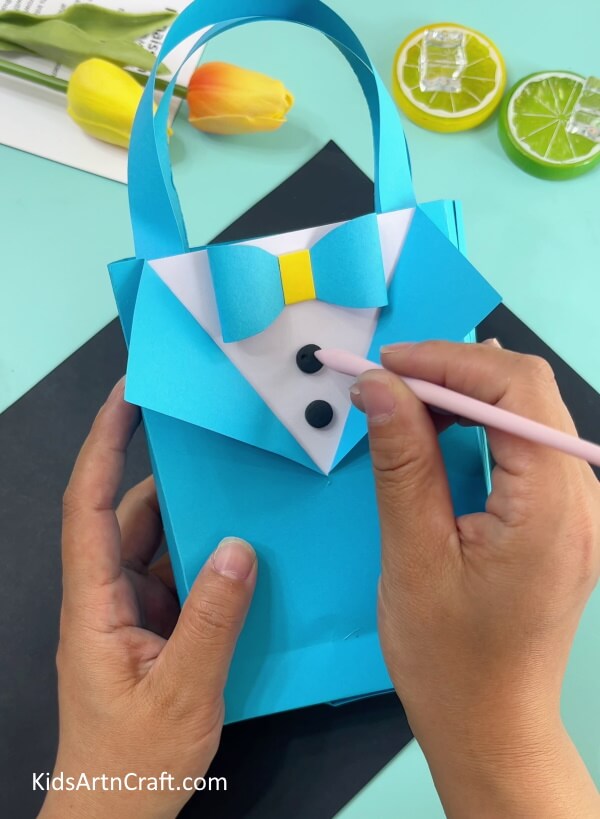 Adding Buttons To Shirt- Home-Based Origami Shirt and Bow Paper Bag Crafting 