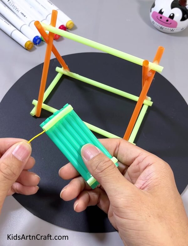 Insert A Tread Inside The Straws - A Step-By-Step Straw Swing Tutorial For Children To Build