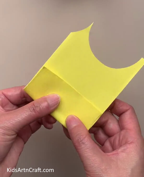 Folding A Piece Of Yellow Paper - Build Tulip Paper Blooms With Youngsters 
