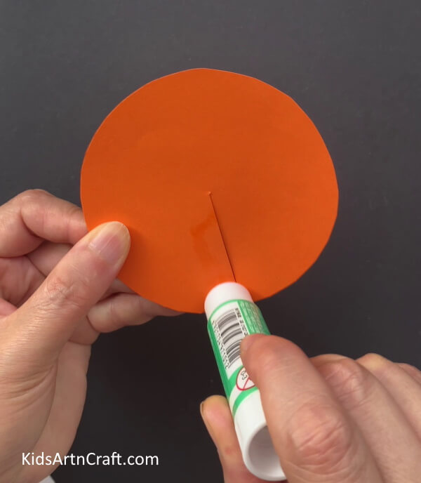 Applying Glue On One Side Of The Radius - This is a simple paper turtle craft that kids can do effortlessly