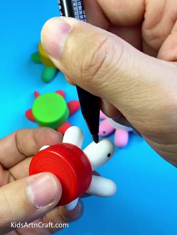 Adding Details-Constructing a Turtle from a Plastic Bottle Cap for Little Ones 