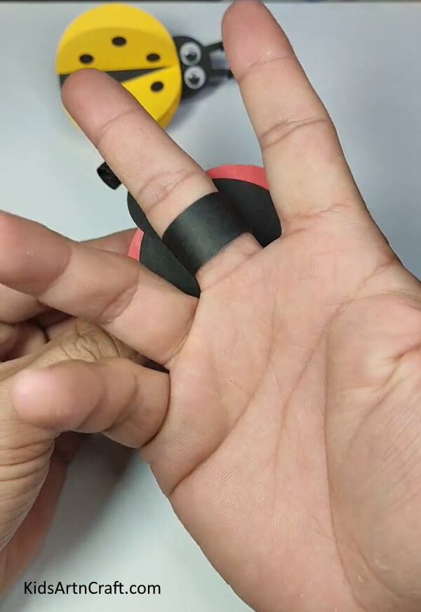 Wearing The Ring On The Finger-A simple tutorial for children to construct a ladybug paper ring. 