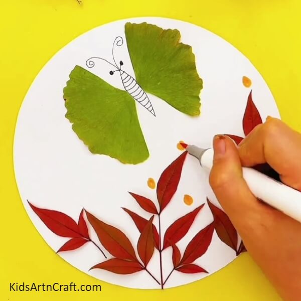Make big dots with a yellow sketch pen around the leaves- Exploring leaf garden and butterfly craft for those just starting out