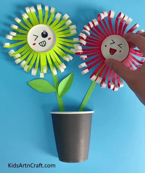 Pasting One More Flower-Show your children how to fashion a Paper Cup Flower