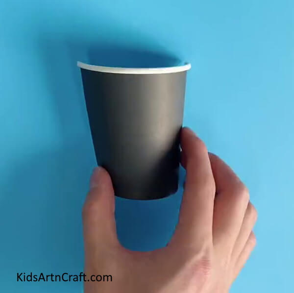 Cutting A Paper Cup In Half-Educate your kids on how to assemble a Paper Cup Flower