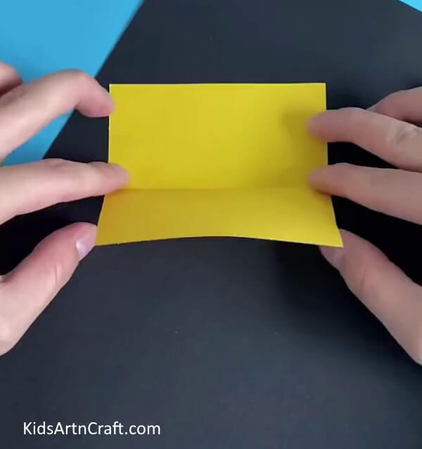 Cutting A Rectangle- Find out how to construct a paper sunflower by following this guide