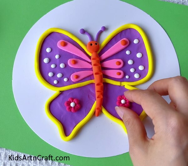 Adding Two Clay Flowers To The Lower Wings-School Crafts DIY Ideas