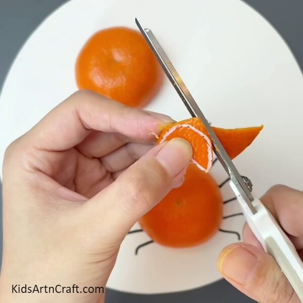 Cutting Out Claws-Become Skilled At Constructing A Crab Design By Utilizing Orange Peel And Leaves