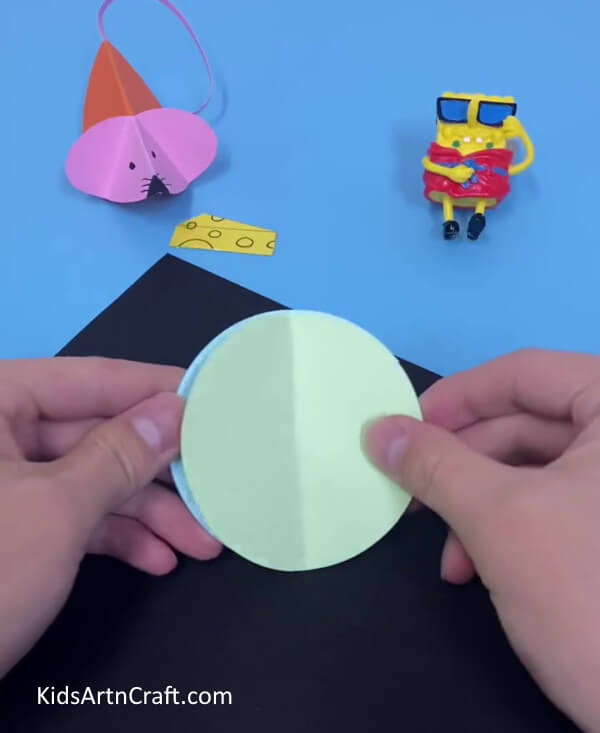 Keep Both the Craft Paper on Top of Each Other- Become proficient in building a Paper Mouse Craft that is simply done 