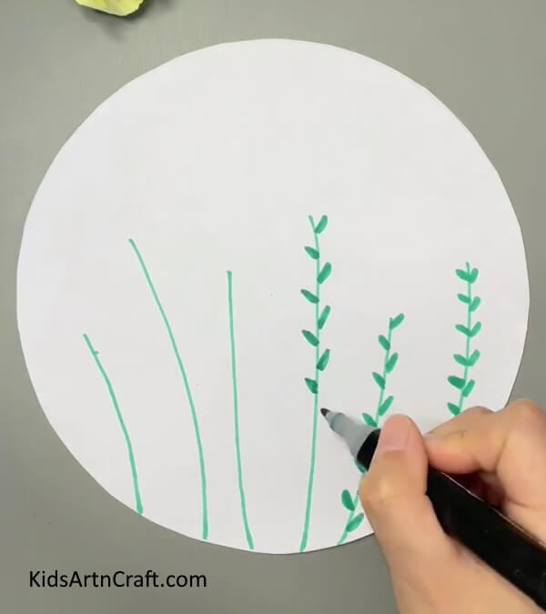 Drawing leaves- Bees Craft Tutorial offers a guide to constructing Egg Carton Flora