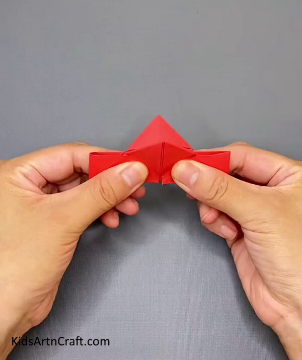 Make a Boat Type Shape by Folding Red Craft Paper- Grasp the ability of forming an Origami Paper Ninja Star with the help of this craft tutorial. 
