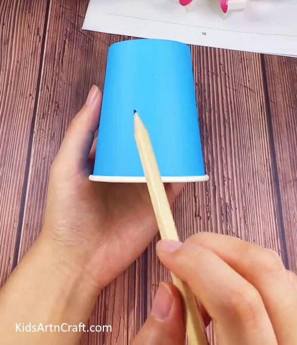 Marking The Paper Cup-Take steps to devise a Paper Cup Octopus Craft for Children