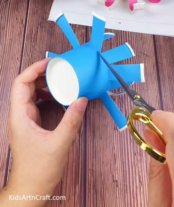 Repeating The Process On Alternate Strips-Devise a Paper Cup Octopus Craft for Minors