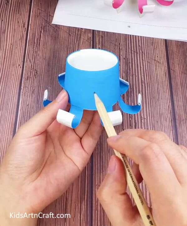 Working On The Rolled Strips-Teach yourself how to craft a Paper Cup Octopus Craft for Youngsters