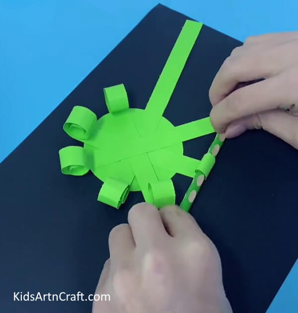 Similarly, Roll All The Other Stripes- Assemble an octopus with paper cups with your toddler.