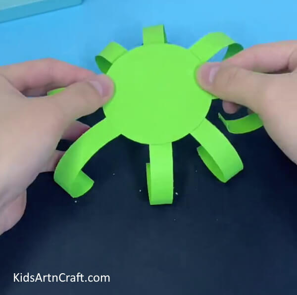Keep The Cutout By Turning To The Other Side- Craft an octopus with paper cups with your toddler.