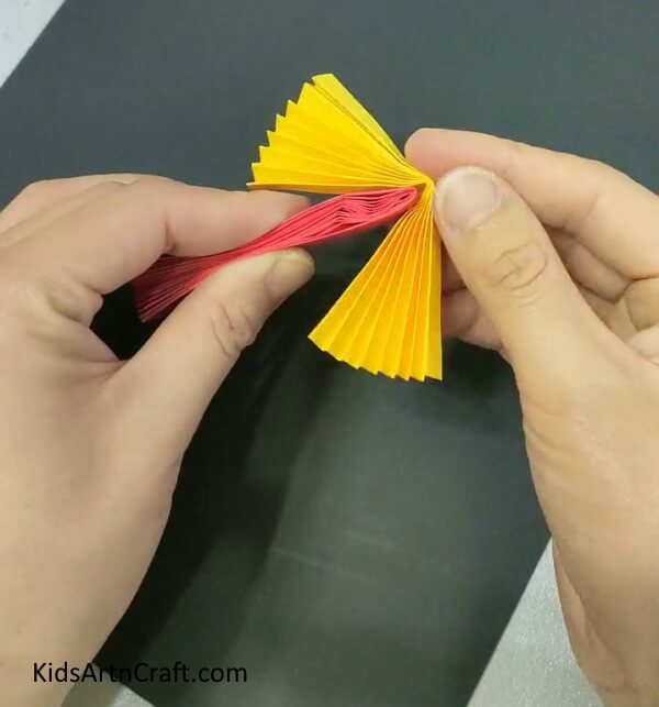 Put The Red Fan In Between The Yellow Fan-Study How To Fabricate A Paper Doll Toy Unproblematic Art For Youngsters