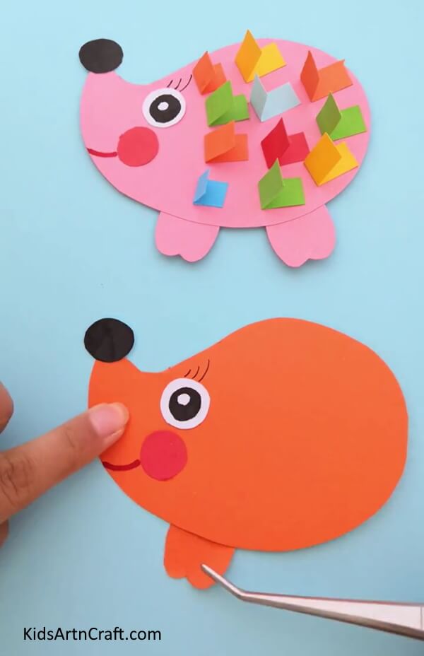 Adding Eyelashes And A Smile - Instruct your kids on constructing a craft using paper